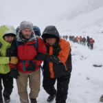 Trekkers being rescued in Tibet’s Karma Valley after a heavy blizzard near Mount Everest.