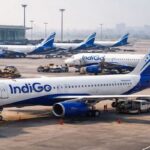 Busy airport with IndiGo aircraft