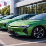 Sleek electric cars outside UK dealership