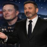 Jimmy Kimmel on stage with cityscape