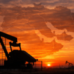 Oil pumpjack at sunset with map
