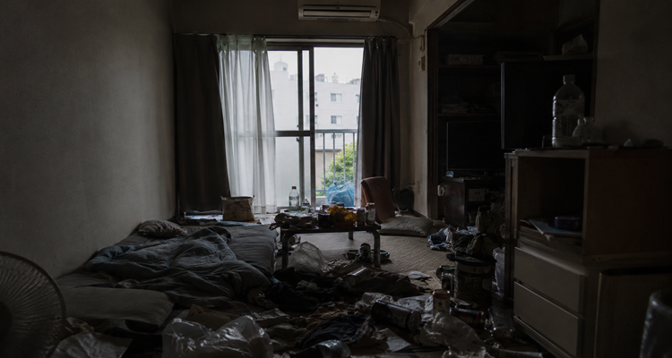 Cluttered urban apartment in dim light
