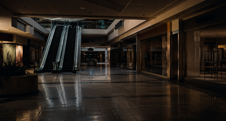 Empty mall corridor with escalators