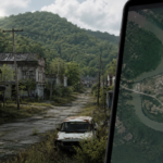 An abandoned ghost town surrounded by overgrown roads and fading buildings